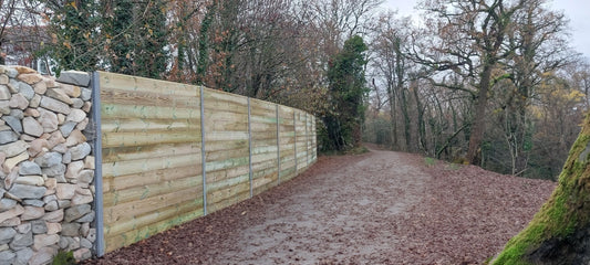 DuraPost® acoustic fences used between a forest and housing 