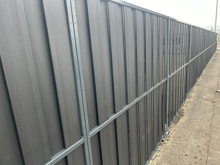 Image of Durapost VENTO® composite hit and miss panels in charcoal with anthracite grey steel fence posts installed for Hertz commercial job