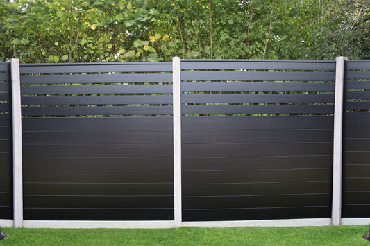 Image showcasing Durapost SLEEK® half privacy aluminium fence panel in black between concreate posts 